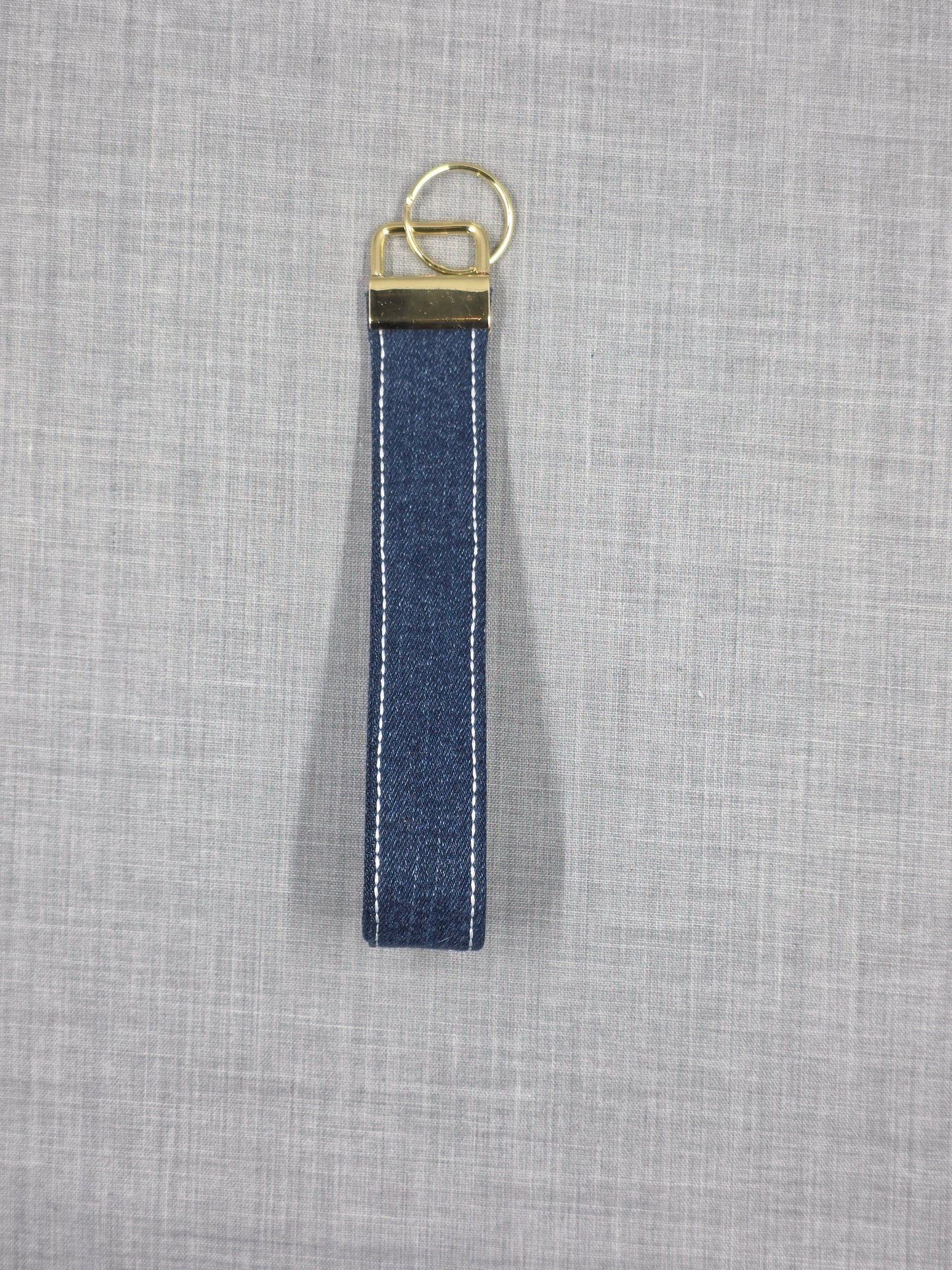 Reworked denim wristlet keychain detail