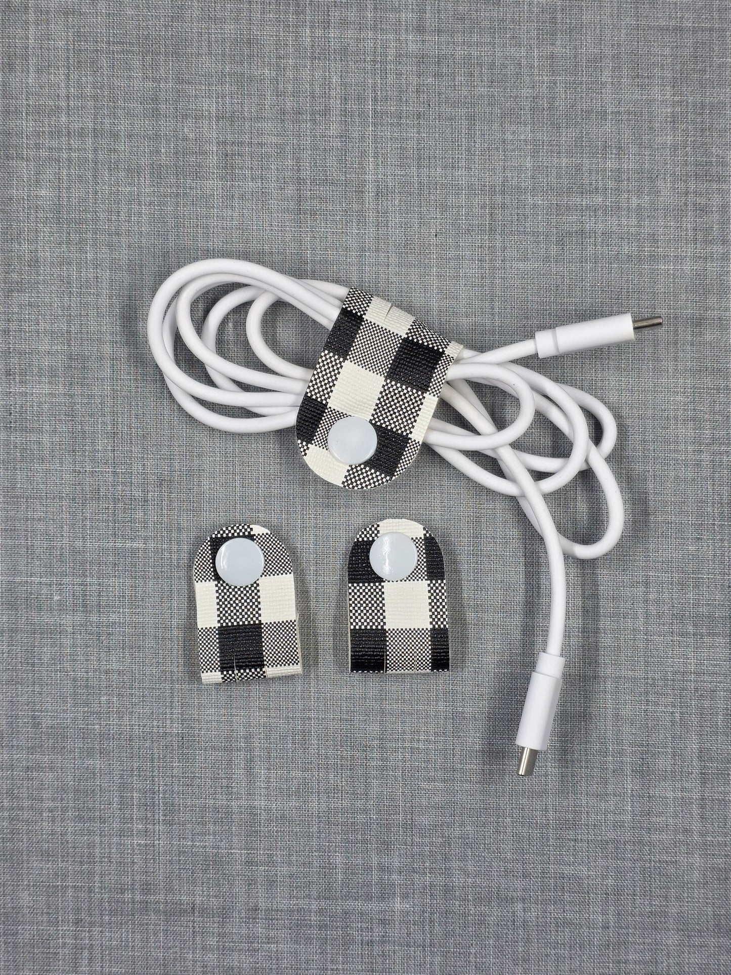 Vinyl cord keeper set in assorted handmade styles