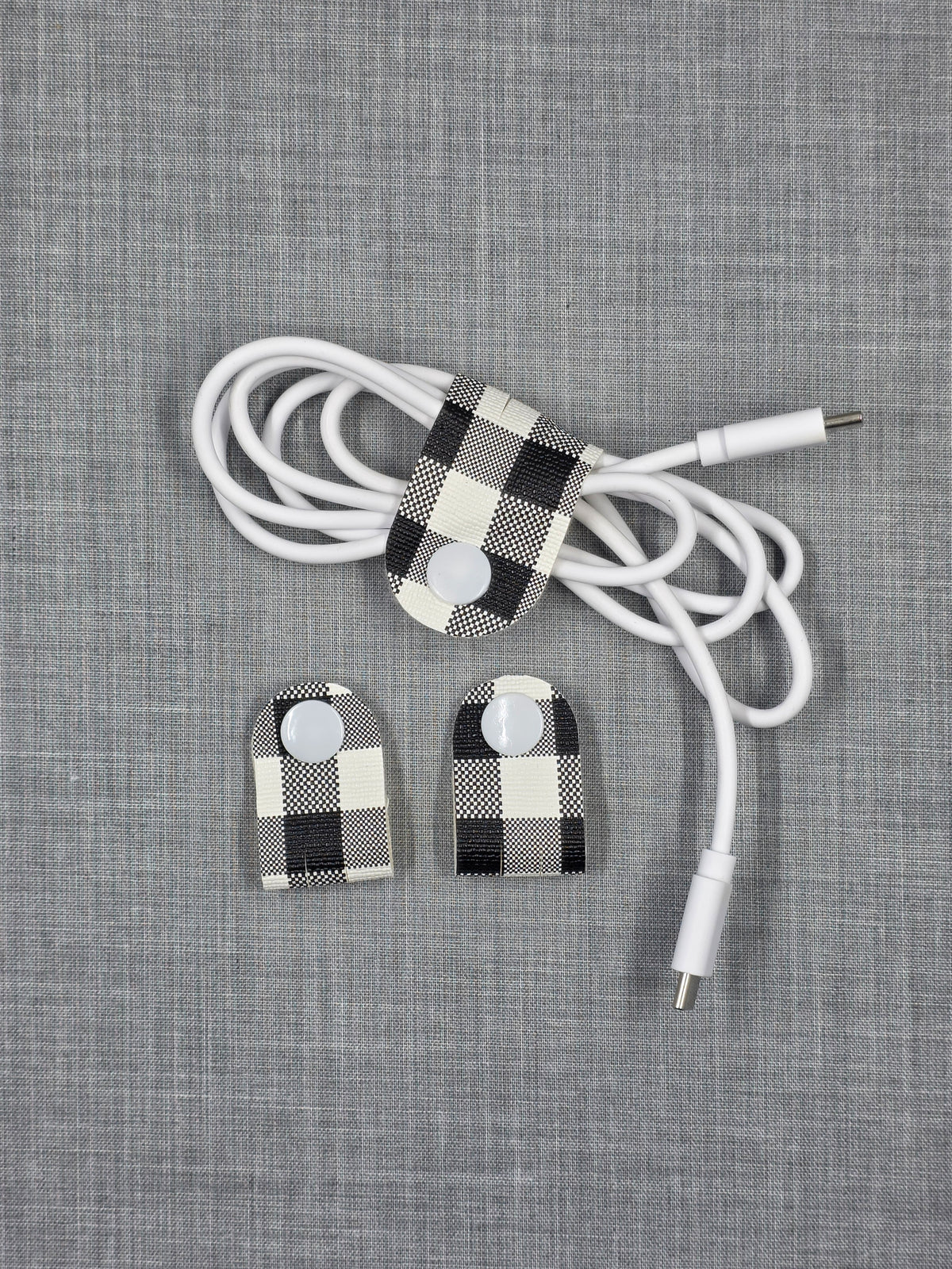 Vinyl cord keeper set in assorted handmade styles